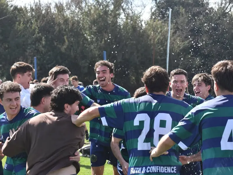 Old Brads players celebrating a win on the pitch